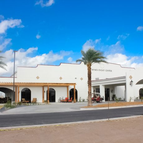 Hynes Event Center, a large building with palm trees in front