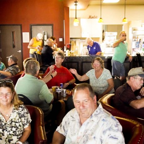 bar and grill interior, people eating and drinking